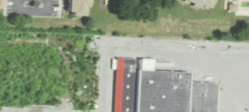 Grocery-Anchored Shopping Center with Pylon Sign