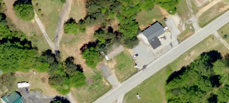 Wooded Land with Pond and Homes