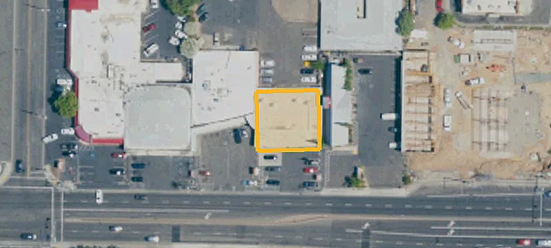 Storefront Building with Parking Field