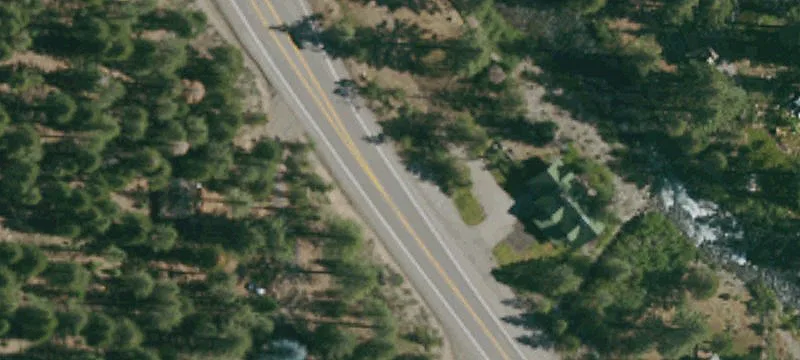 Riverfront Land Parcel with Forest Backdrop