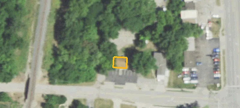 Office Building with Mostly Paved Lot