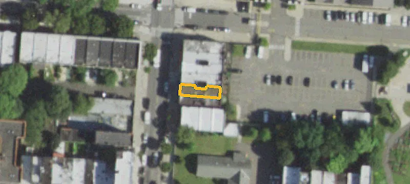 Corner Mixed-Use Building with Private Parking