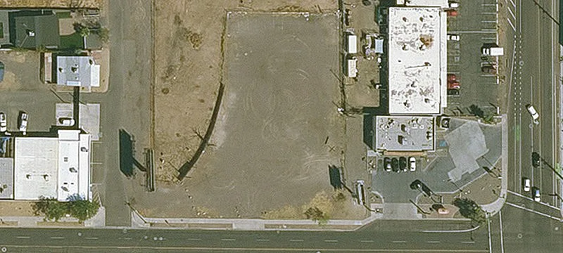 Fenced Paved Parking Lot