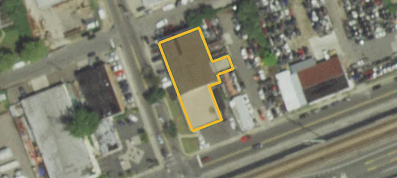 Corner-Lot Auto Shop with Yard