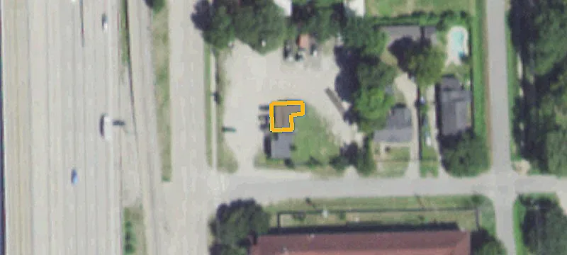 Fenced Industrial Yard with Building