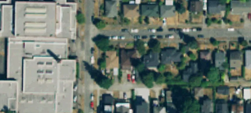 Occupied Triplex with Off-Alley Parking