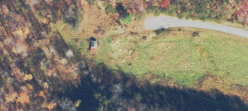 Farmland with Stream and Barn