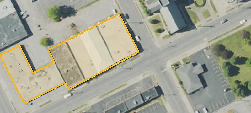 Corner Storefront Building with Overhead Door