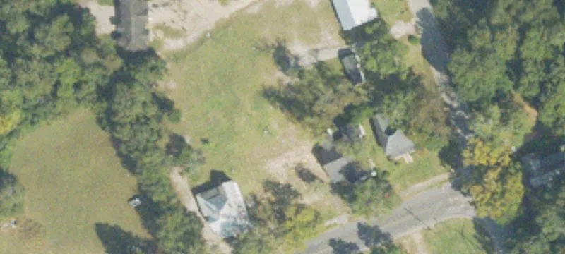 Fenced Commercial Land with Building