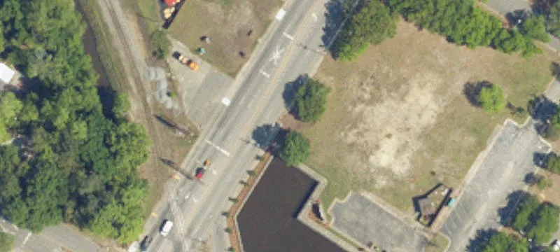 Cleared Commercial Land with Curb Cut