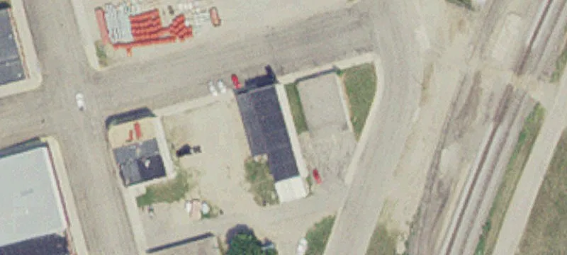 Storefront Building with Gravel Lot