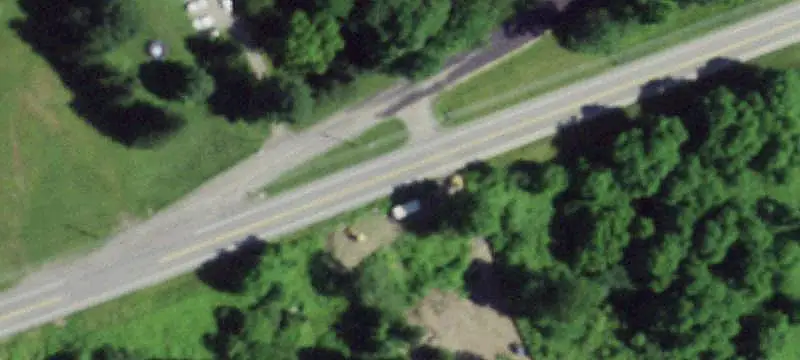 Campground With Cabins and Trailer