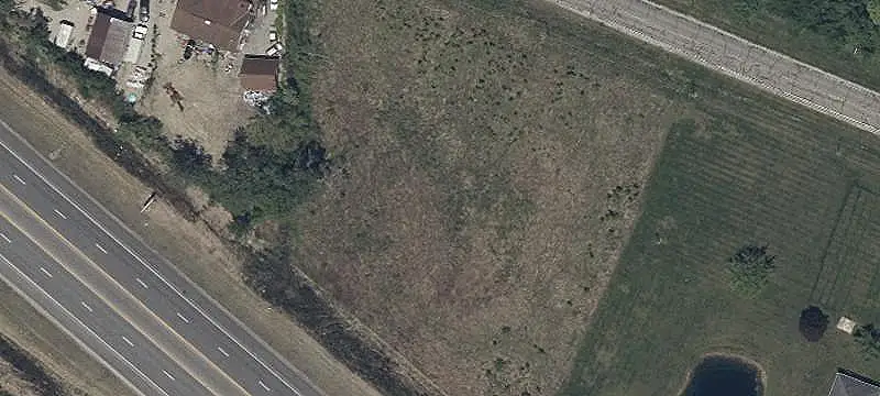Commercial Land With Existing Improvements