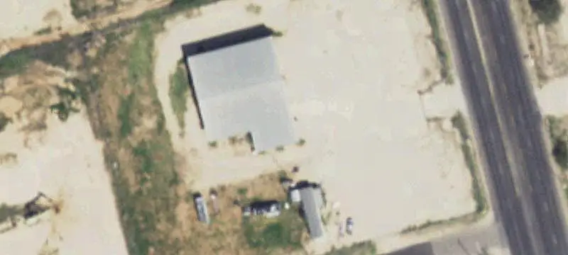 Fenced Commercial Land with Pole Barn