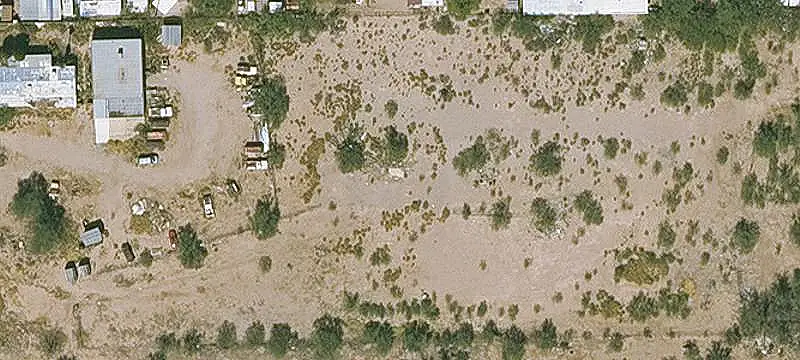 Fenced Warehouse Lot with Six Doors