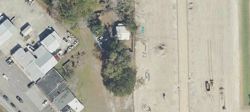 Fenced Commercial Land with Pole Barn