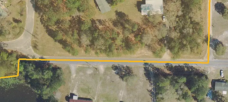 Lightly Wooded County Land