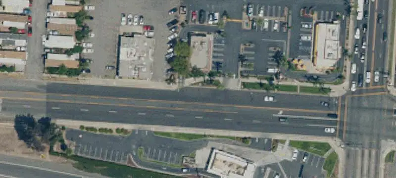 Two-Story Shopping Center with Pylon Signage