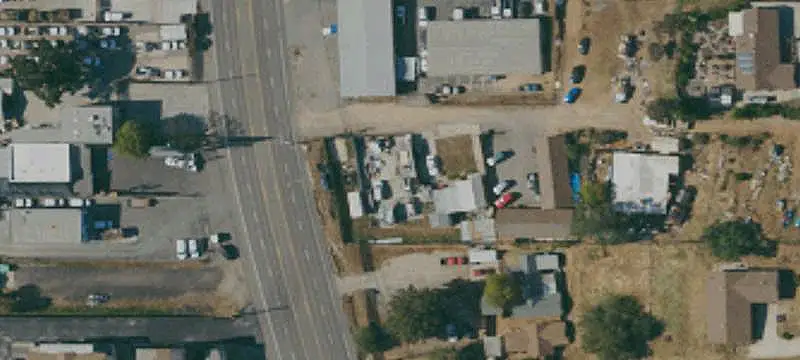 Fenced Industrial Yard with Building