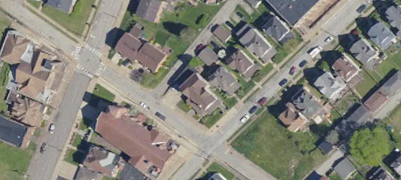 Corner-Lot Duplex with Four-Car Garage