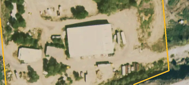 Fenced Farm With Industrial Buildings