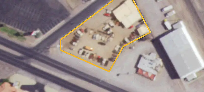 Fenced Commercial Land with Improvements