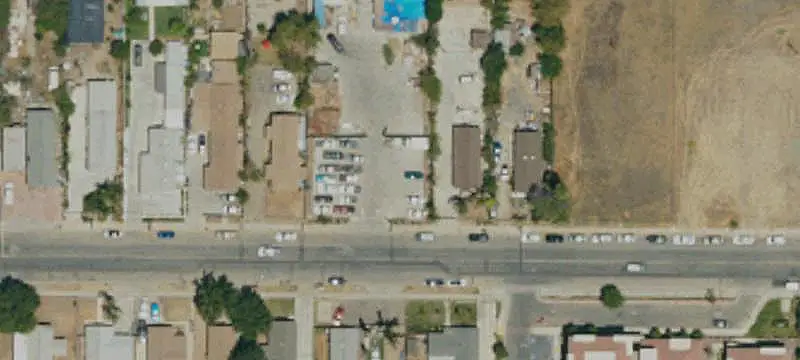 Fenced Commercial Land with Improvements