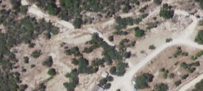 Wooded Farm With Multiple Structures