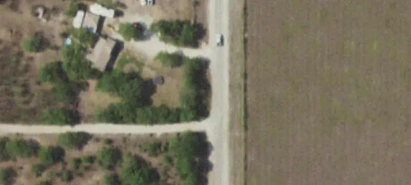 Fenced Farmland With Metal Building