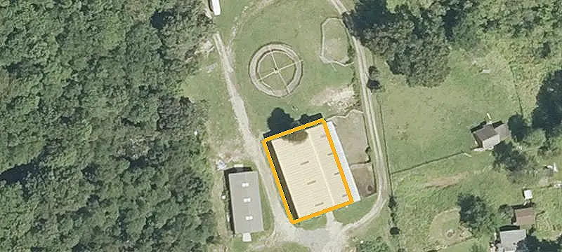 Fenced Equestrian Facility with Indoor Arena