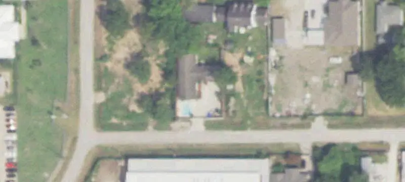 Fenced Commercial Land with Building
