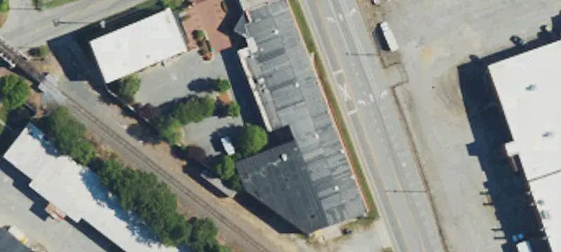 Walled Industrial Property with Two Buildings