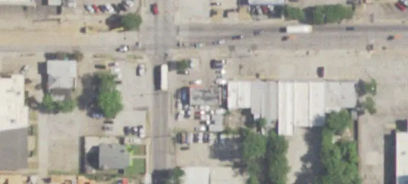 Corner Auto Shop With Fenced Yard