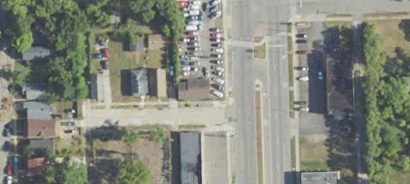 Fenced Commercial Land with Building
