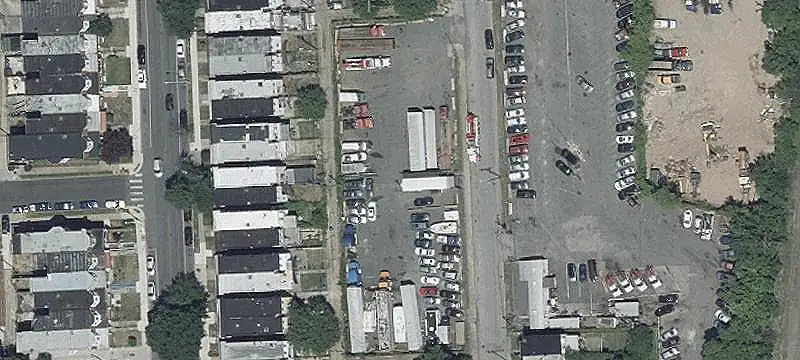 Fenced Paved Parking Lot