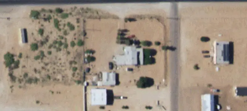 Fenced Commercial Land with Building