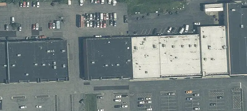 Occupied Shopping Center With Land Parcel