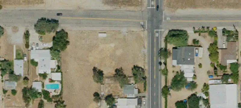 Fenced Commercial Corner Land