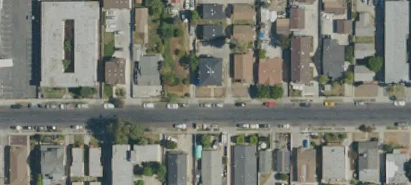 Apartment Building With Additional Houses