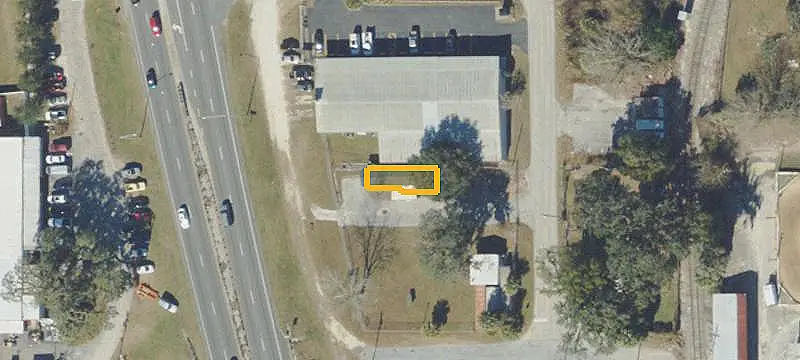 Fenced Commercial Land with Improvements