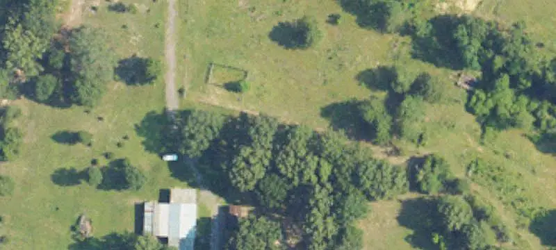 Fenced Farmland with Warehouse
