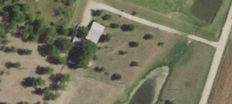 Fenced Farm with Barn and Pond