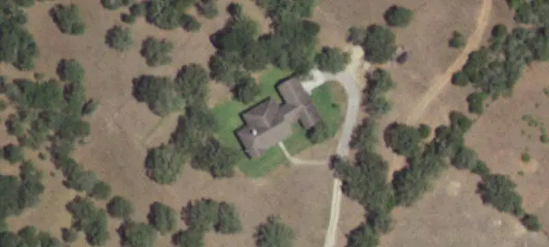 Ranch with Stone Home and Pond