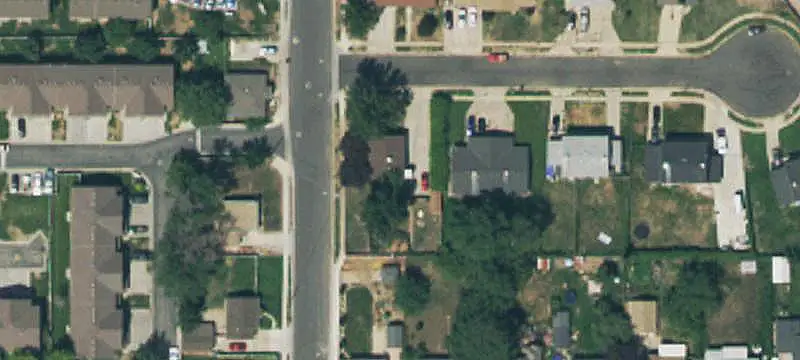 Corner-Lot Duplex with Storage Sheds