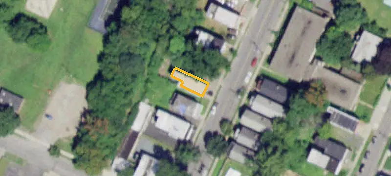 Brick Triplex with Vacant Lots