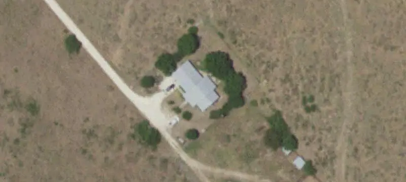 Fenced Ranch with Rock Home