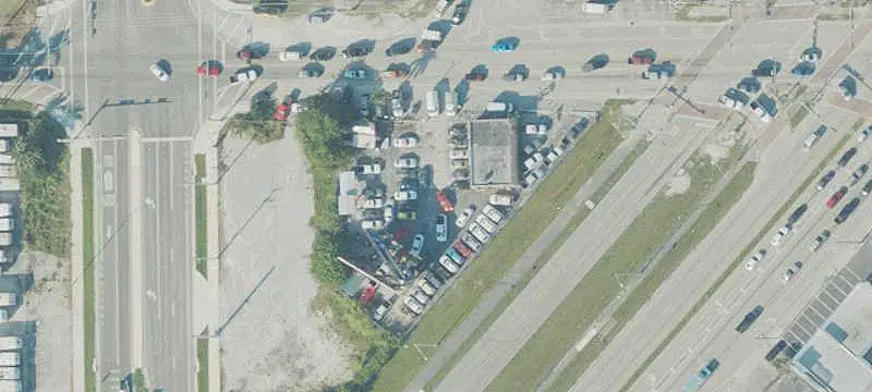 Fenced Automotive Dealership Property