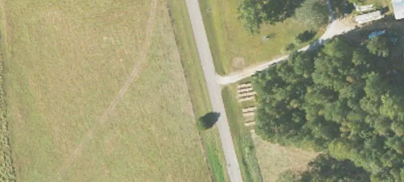 Fenced Pastureland With Pond