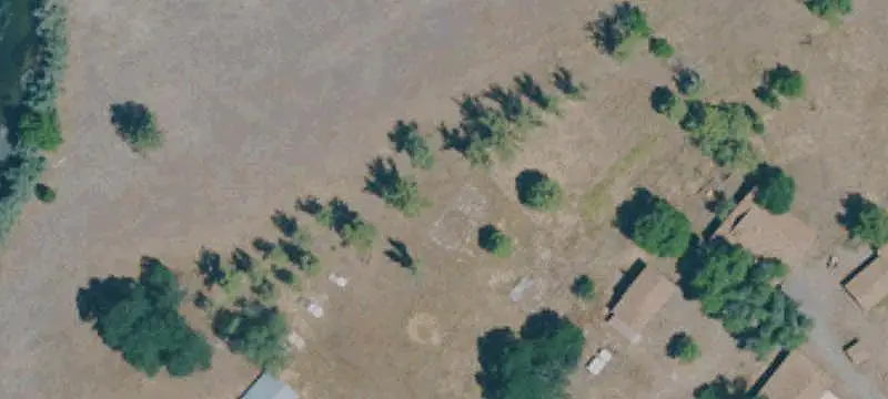 Riverfront Land with Forested Hillside