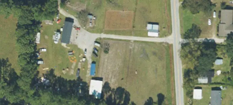Unzoned Commercial Land with Improvements